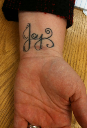 And not only is it a joy tattoo, it's a pretty, swirly, joy tattoo.